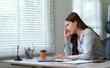 © crizzystudio - Stressed asian businesswoman having problem using laptop computer at office desk
