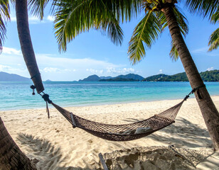 Wall Mural - serene beach scene featuring hammock suspended between two palm trees, overlooking tranquil sea with distant mountains. soft sand and gentle waves create peaceful atmosphere