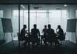 © stock.metket.com - A group of people are having a meeting in a conference room behind glass