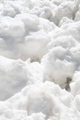 Poster - Fresh snowdrift landscape, close-up view of white snow piles on sunny day, winter wonderland scene, natural light, outdoor mountain location