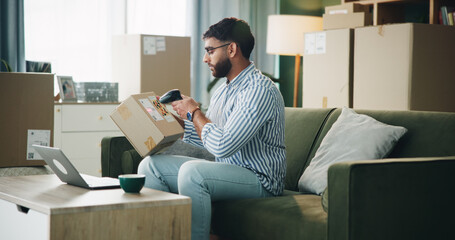 Poster - Home, small business and man with box, scanner and machine for label and address. Laptop, entrepreneur and person in apartment with package, stock or barcode for inventory management or dropshipping