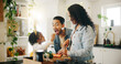 © peopleimages.com - Kitchen, family and snack with vegetables for cooking, nutrition and bonding together in home. Daughter, man and woman with chopping board for meal prep, dinner and support with girl and taste