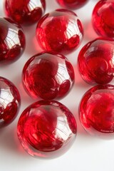 Aufkleber - Close-up of Shiny Red Glass Spheres on White Surface, Top-Down View, Macro Photography, Studio Shot, Decorative Elements