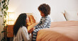 © peopleimages.com - Bedroom, mom and talking to child, sad and comfort for son in family home, chat and care in apartment. Conversation, kid and woman with concern in house, love and communication with unhappy boy