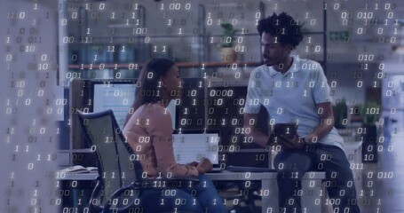 Poster - woman typing laptop and man holding tablet discussing tech in office, with floating binary digits
