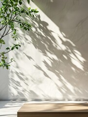 Poster - Interior scene with tree branch casting shadows on marble wall and floor with wooden table in foreground