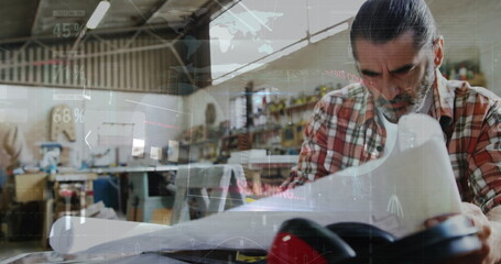 Poster - Image of world map and data processing over caucasian male carpenter working in workshop