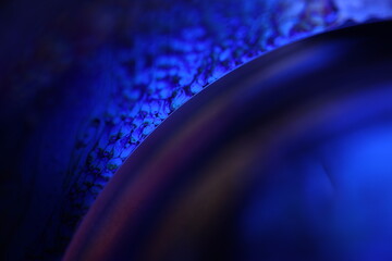 Poster - Deep blue liquid surface on black background, oil stains movement, bright chemistry, surreal background, blue sky colour
