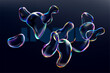 © theromb - Glass iridescent liquid bubbles on dark background. 3D Transparent fluid  drops.