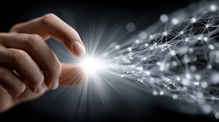 Fototapete - A hand is reaching out to touch a light