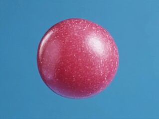 Poster - Floating pink sphere on blue background studio shot abstract art object close up macro simple clean design