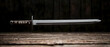 © predator - Long Sword On Wooden Table