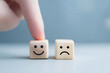 © mcjanuald - Selection of happiness over sadness symbolized by fingertip on smiling cube