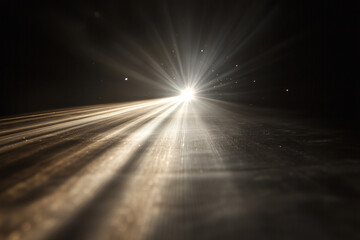 Poster -  bright light is shining on a dark road. The light is so bright that it is almost blinding. The scene is set in the middle of the night, and the darkness of the road is emphasized by the light
