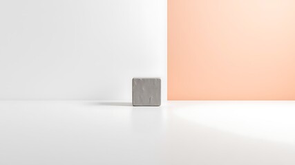 Poster - Minimalist concrete cube displayed on a white surface with pastel peach and white walls