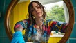 © PB Studio - dying her own hair in bathroom mirror with gloves on, applying color to roots with visible gray underneath, showing real home care home hair dye, self-care moment, woman coloring hair, DIY beauty,