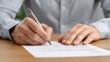 © Dzikrul Husnani - Signing Document Man's Hand Writing with Pen on Paper