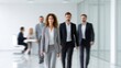 © Dzikrul Husnani - Business People Walking in Modern Office Space Confidently