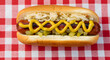 © ELMORE - All American Hotdog With Mustard And Toppings On A Picnic Blanket