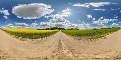 Wall Mural - hdri 360 panorama on gravel road near rapeseed fields in equirectangular full seamless spherical pro