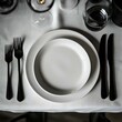 © Shehroo Time - Clean Dining Scene with White Plate and Dark Cutlery