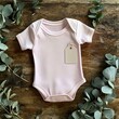 © Shehroo Time - Pink Baby Onesie with Tag and Eucalyptus Accent