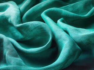 Poster - Turquoise fabric drapes in soft folds creating a luxurious texture close up studio shot for fashion design and textile art projects