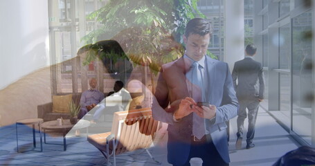 Poster - Image of caucasian man with smartwatch over businessman using smartphone