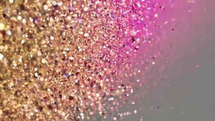 Poster - Sparkling glitter in gradient of pink and gold tones on gray background  