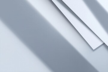 Fototapete - Minimalist white paper arrangement under a stark light creates an abstract and serene design, suitable for backgrounds or creative projects.