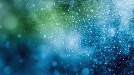 Vibrant abstract background of blue and green bokeh lights.