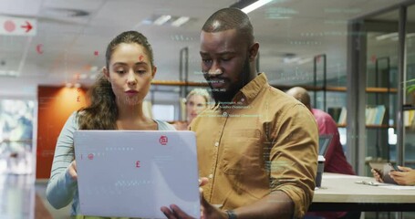 Poster - Woman holding laptop and man pointing at code, collaborating in tech library showing floating icons