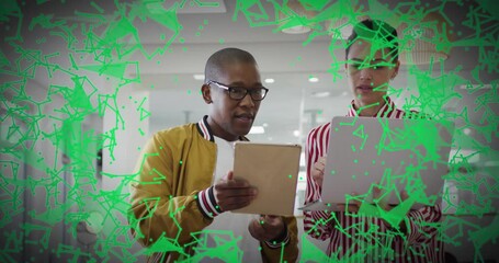 Poster - Colleagues holding tablet and laptop, overlaying green network graphics for technology workflow