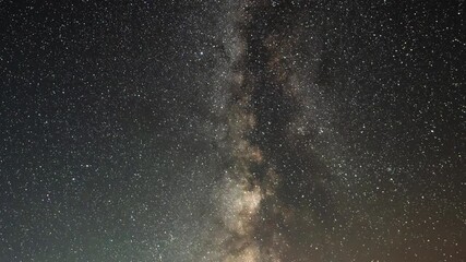 Wall Mural - beautiful night sky time lapse with milky way galaxy on dark sky. starry night background.
