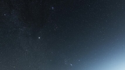Wall Mural - beautiful night sky time lapse with milky way galaxy on dark sky. starry night background.