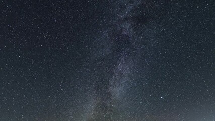 Wall Mural - beautiful night sky time lapse with milky way galaxy on dark sky. starry night background.