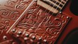 © CamBot - Intricate leather guitar detail reddish brown floral embossing