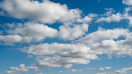 Aufkleber - heaven sky is blue with a few clouds scattered throughout. The clouds are white and fluffy, giving the sky a peaceful and serene.