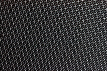 Abstract Geometric grid background, carbon mesh texture. Modern dark macro texture. Close-up object concept