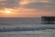 © Sarah - Beautiful pink orange ocean sunset at Pacific Beach San Diego California with boardwalk