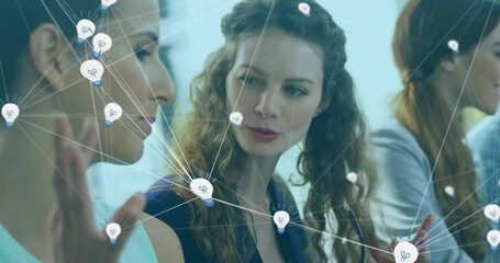 Poster - business professionals meeting in office, sharing digital network with light bulb icons overlay
