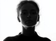 © oio - dramatic black and white silhouette portrait of a young woman with intense expression and high contrast lighting