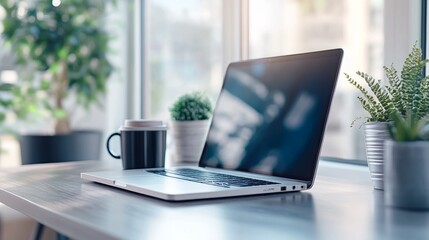 Poster - Crisp and clean workspace closeup showing productivity essentials: laptop and coffee