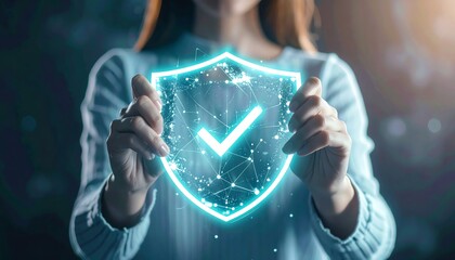 Poster - A person holds a glowing digital shield symbolizing security and protection, representing modern technology and cybersecurity concepts