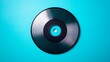 © hnuengrudee - Black record disc on bright blue background music industry concept vinyl record for dj turntable vintage audio recording media with creative colorful backdrop