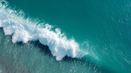 Poster - Vibrant turquoise waves tumble with white foam against the sandy beach, capturing the energizing essence of the ocean on a sunny day
