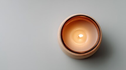 Aufkleber - The scene showcases a single flickering candle resting on a spotless white surface, radiating warmth and inspiring creativity in its minimalist surroundings