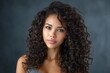 © Dzikrul Husnani - Woman Portrait with Curly Hair Looking at Camera
