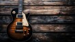 © BozStock - An electric guitar rests on a warm wooden background.