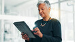 © peopleimages.com - Business, research and tablet with mature woman in office for information, project management, report. App, data and review with employee person in professional workplace for company development